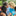 And adult with various-aged children in an outdoor setting