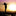 Silhouette of a woman standing on a dock next to the ocean with her arms outstretched looking toward the sky