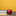 A red apple next to two stacked books and a pencil