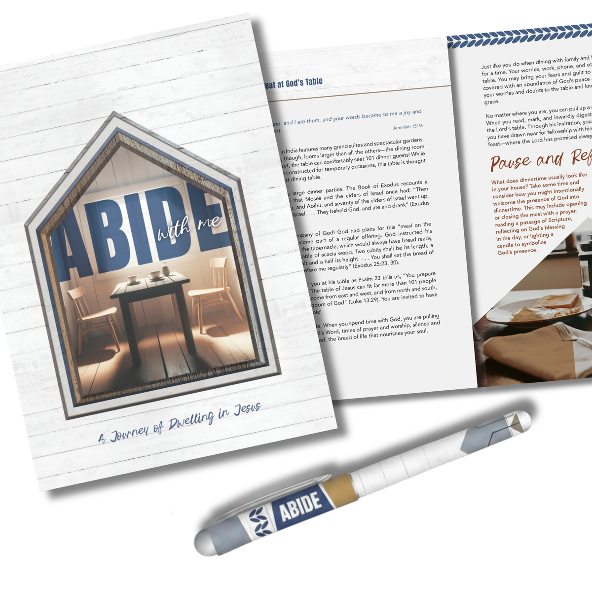 A printed booklet or magazine titled "ABIDE with me" is shown at an angle on a white background, with one page open to reveal text and a photo, and a pen placed in front. The pen and booklet both display the ABIDE logo by CTA Christ to All & CTA Gifts.