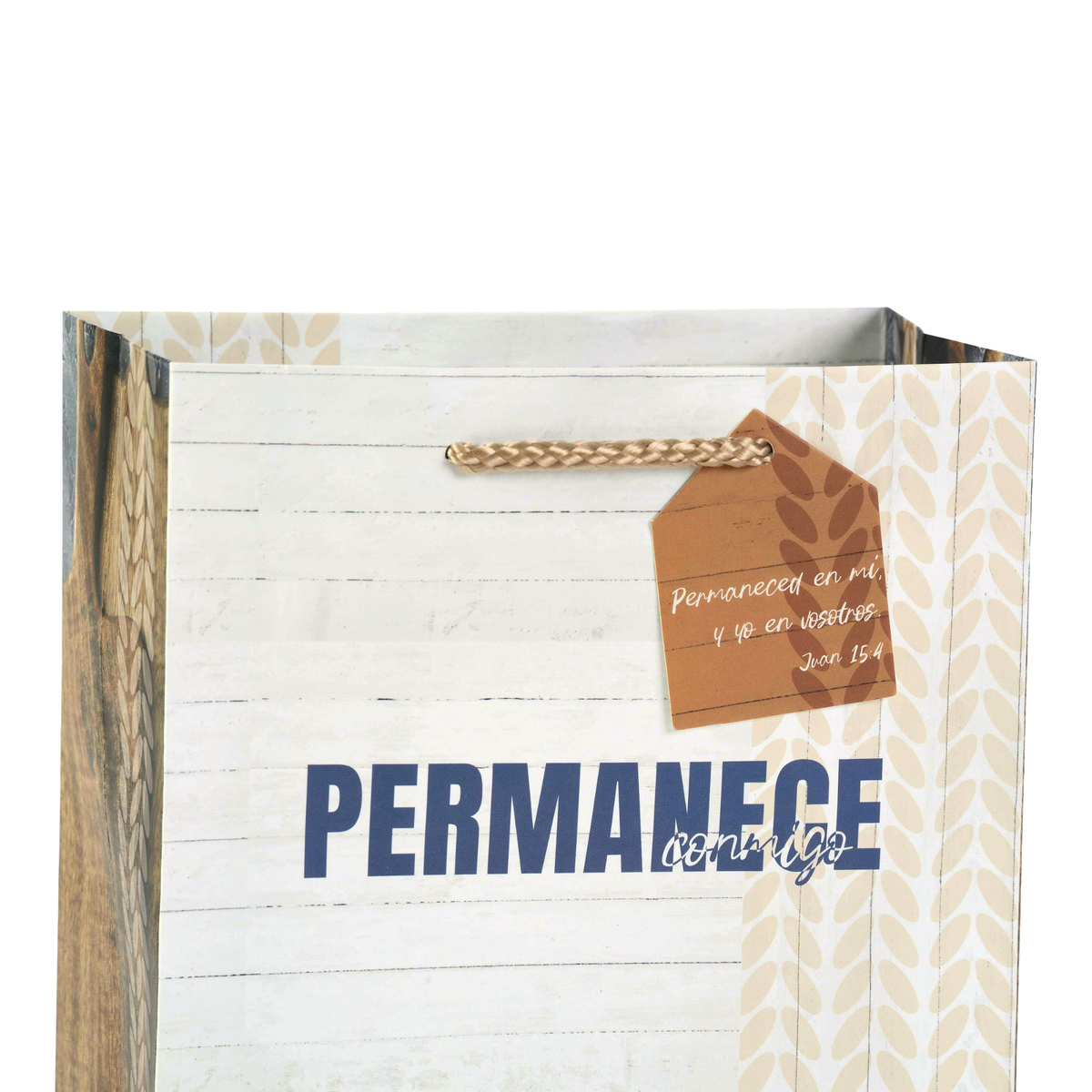 A decorative paper gift bag with a white wood-plank style front panel, blue 'PERMANECE' text, beige leaf pattern side panels, a brown woven handle, and a hanging brown tag with handwritten text by CTA Christ to All and CTA Gifts.