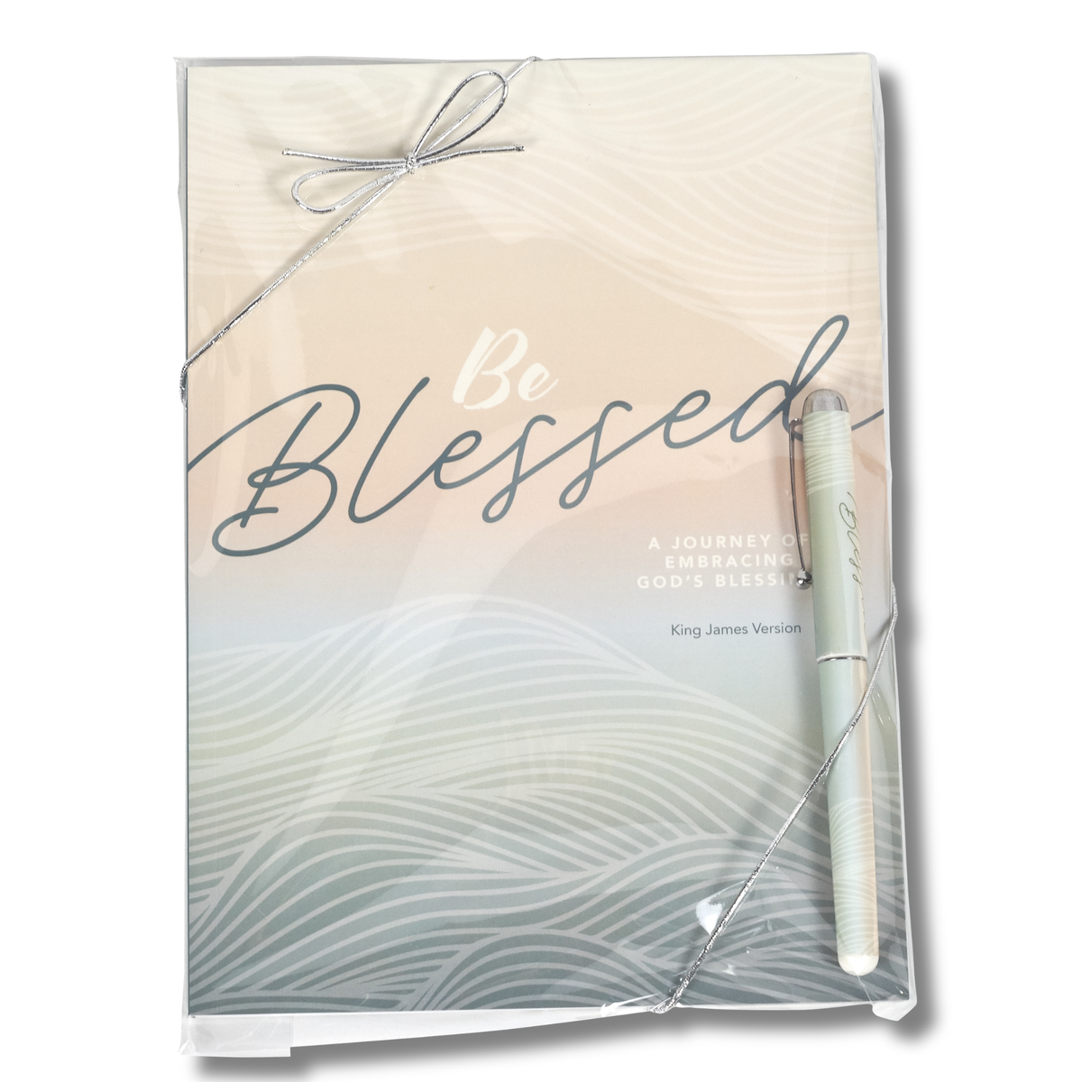 A packaged journal titled 'Be Blessed' with a matching pen, wrapped in clear plastic with a silver ribbon bow, on a white background by CTA Christ to All & CTA Gifts.