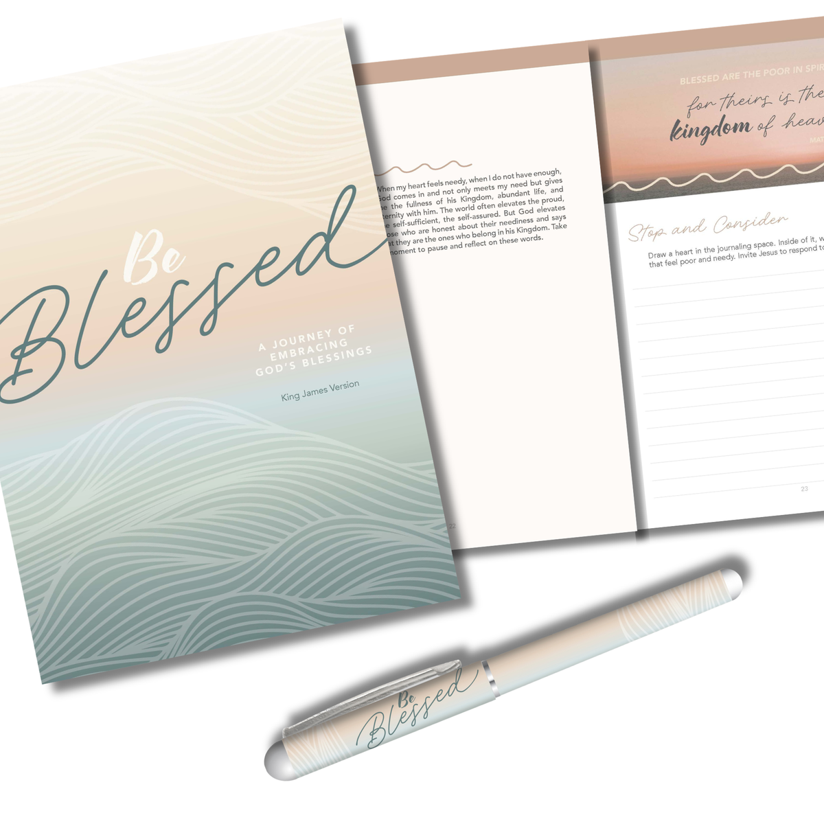 A Bible journal set featuring a soft gradient cover with wavy line patterns, an open interior page with printed scripture and writing prompts, and a matching white pen with 'Blessed' printed on it, arranged on a clean white background by CTA Christ to All & CTA Gifts.