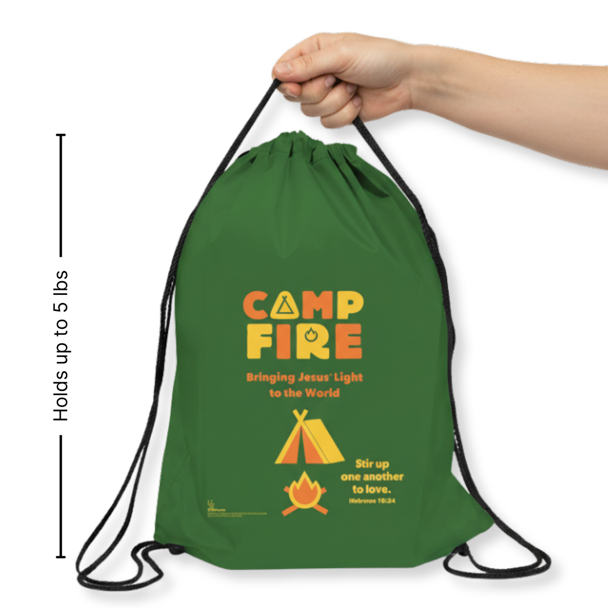 Green drawstring bag with 'Camp Fire' branding and text, held by a hand on a white background.
