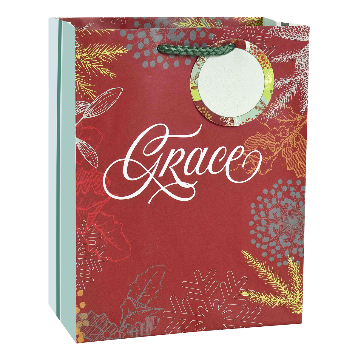 A red gift bag with white script text reading 'Grace' and a circular white insert, decorated with gold and silver winter botanical illustrations including pine branches, snowflakes, and holly leaves. The bag has a green braided handle and a light blue side panel by CTA Christ to All & CTA Gifts.