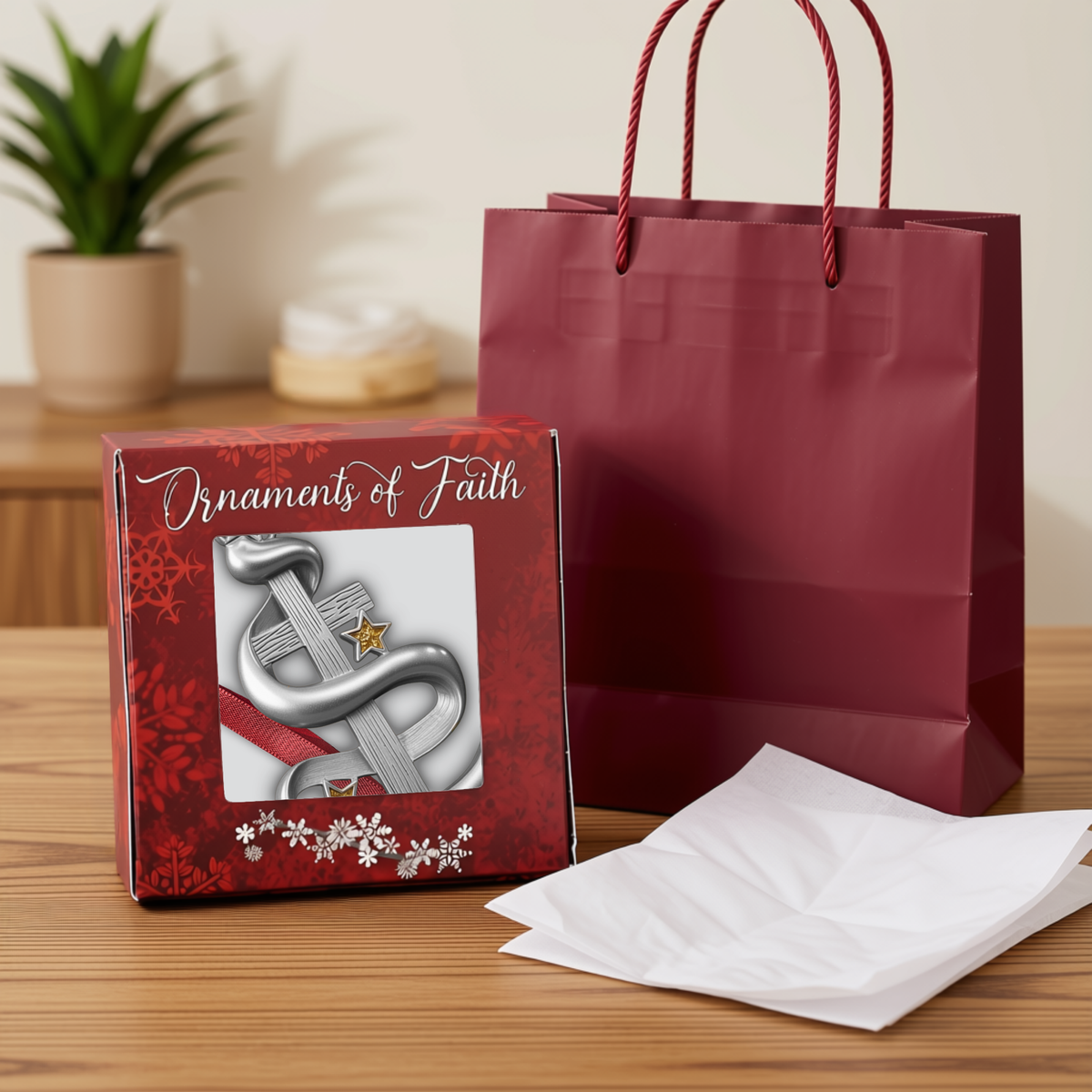 A silver-toned metal Christmas ornament featuring a relief carving of the Holy Family, hanging from a red ribbon on a decorated Christmas tree branch with warm lights in the background.