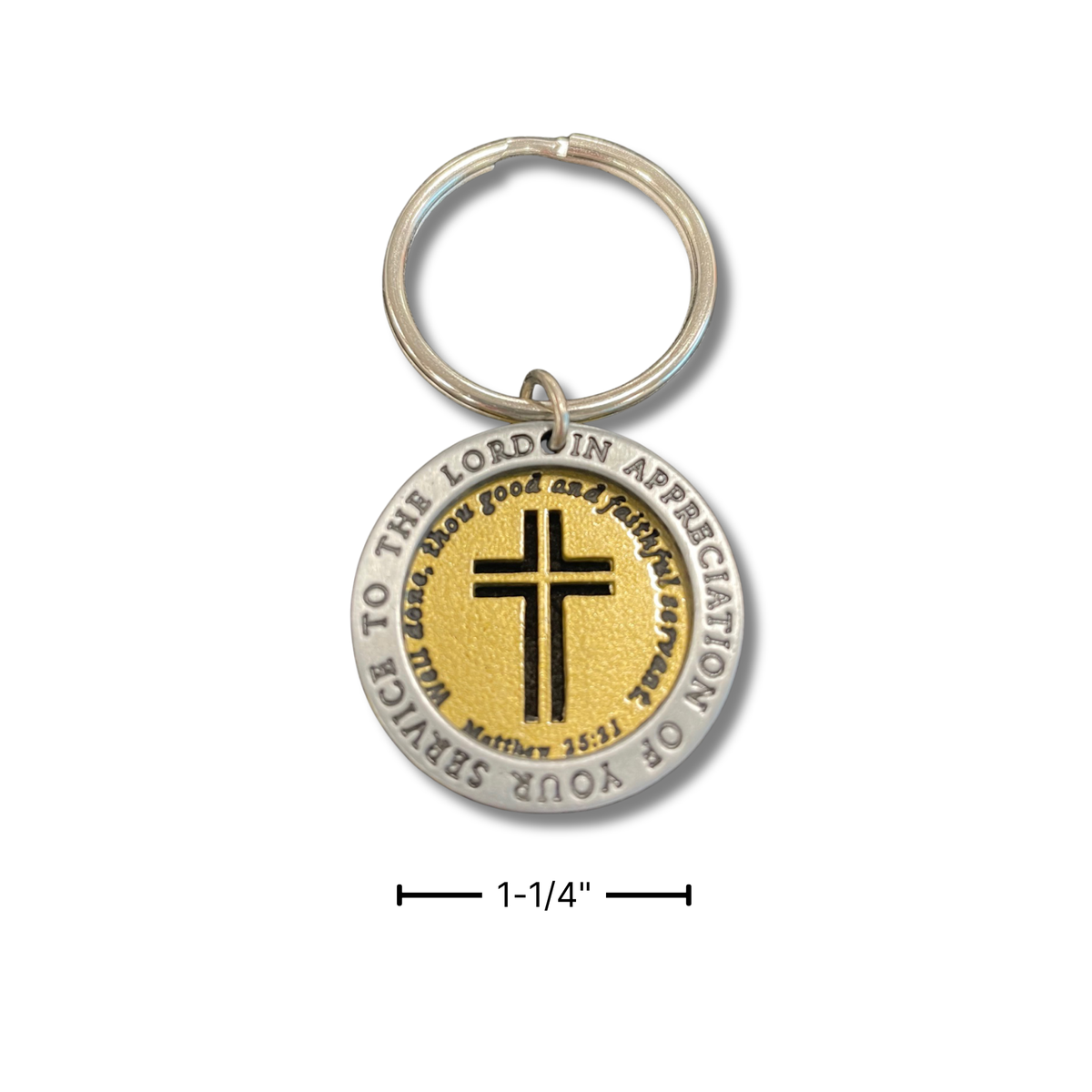 A round silver-toned and gold-toned Lord of Prayer keychain with a black cross in the center, shown on a white background with a 1-1/4 inch size marker below by CTA Christ to All and CTA Gifts.