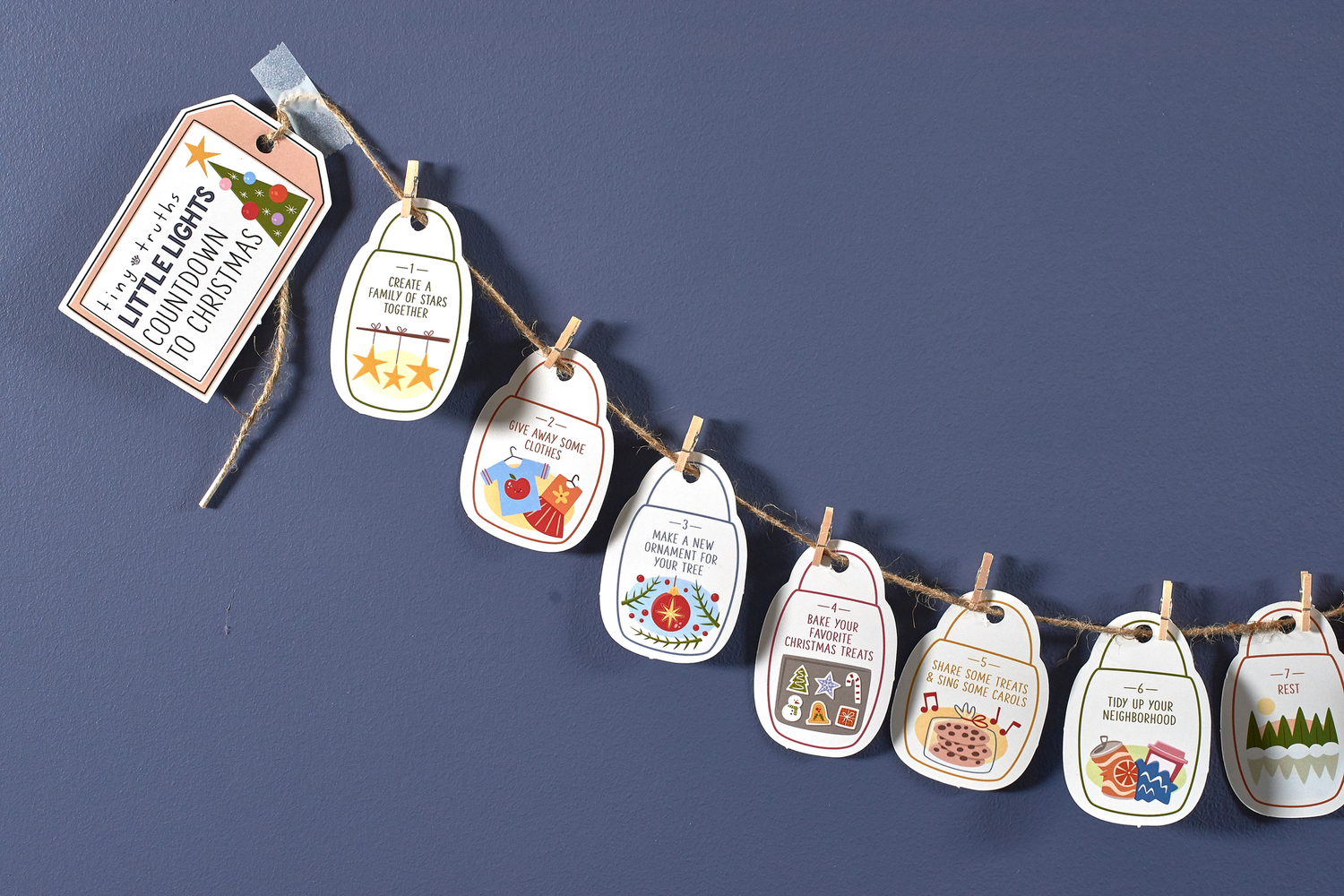 Countdown to Christmas family activity set with 25 numbered cardstock cards, jute twine, and mini clothespins for daily December activities. Includes a digital Grown-Ups Guide to enhance the experience.
615122-17488-3