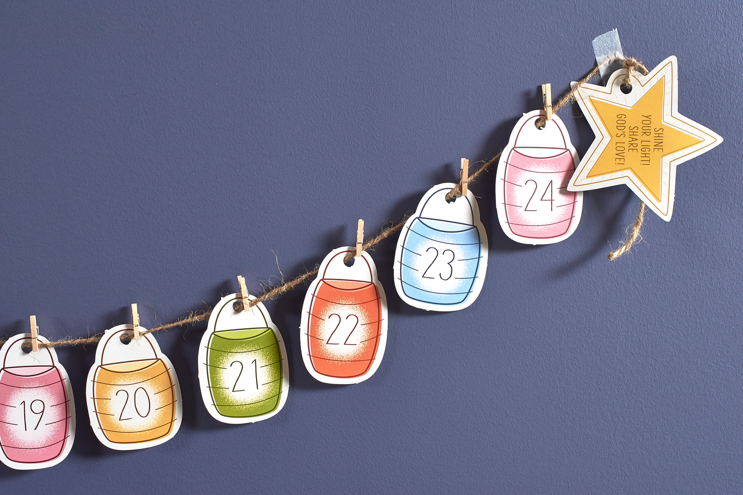 Countdown to Christmas family activity set with 25 numbered cardstock cards, jute twine, and mini clothespins for daily December activities. Includes a digital Grown-Ups Guide to enhance the experience.
615122-17488-3