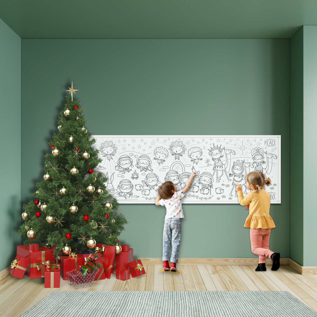 A large black-and-white children's wall mural or poster hangs on a green wall in a decorated holiday room, with a Christmas tree, wrapped presents, and two children standing in front of it.