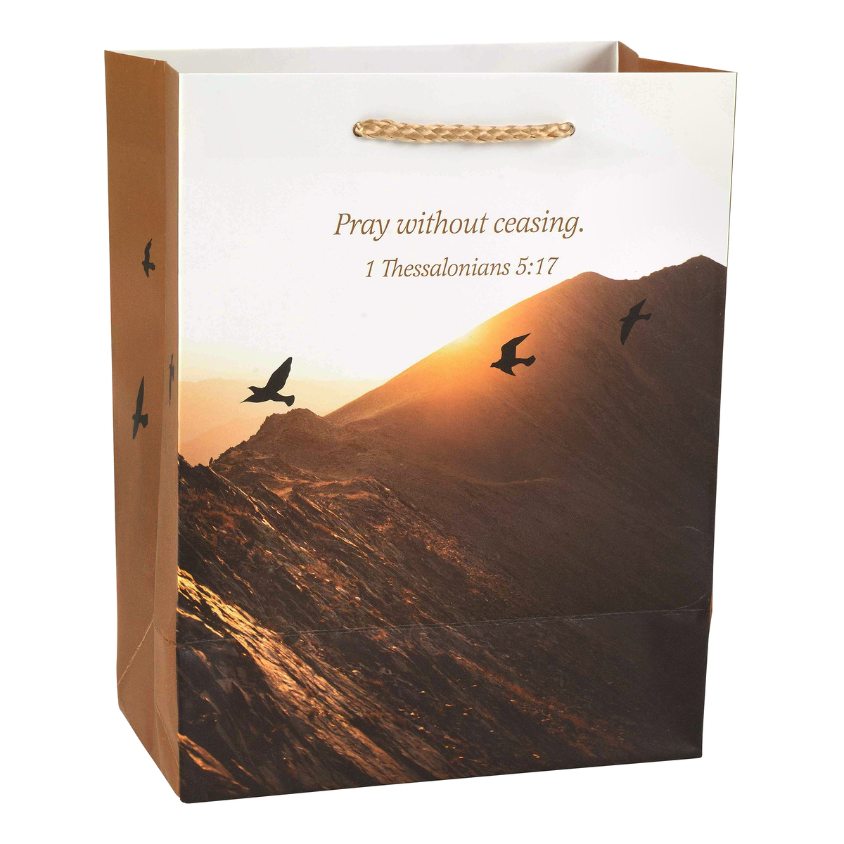 A brown paper gift bag with a printed mountain sunset design on the front panel and the text 'Pray without ceasing. 1 Thessalonians 5:17' by CTA Christ to All and CTA Gifts.