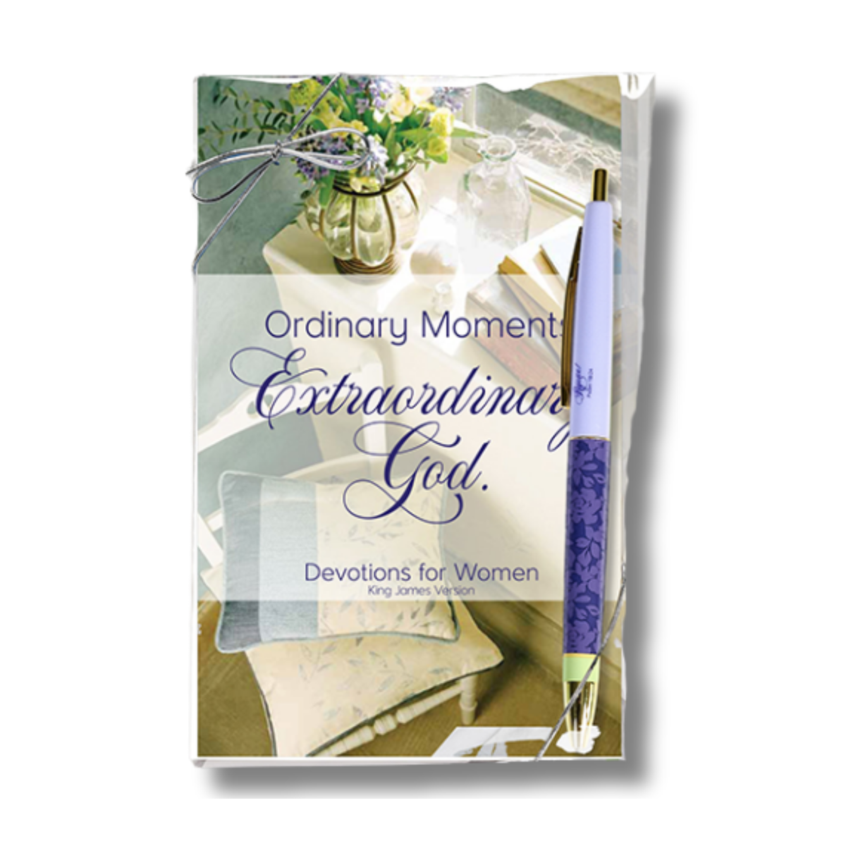 A boxed devotional product titled 'Ordinary Moment Extraordinary God. Devotions for Women' with a floral photo on the front, shown with a purple pen resting beside it on a white background by CTA Christ to All.