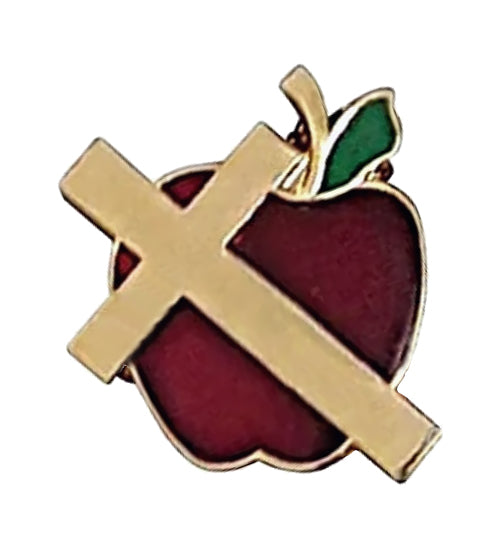 A small enamel pin shaped like a red apple with a green leaf, overlaid with a gold Christian cross, on a plain white background.