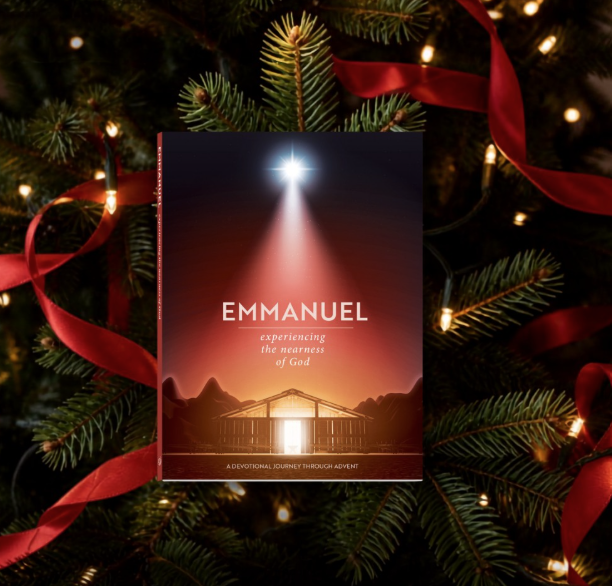 Cover of Emmanuel: Experiencing the Nearness of God, an Advent devotional book featuring a radiant star above a manger scene, displayed among evergreen branches, Christmas lights, and red ribbon by CTA Christ to All and CTA Publishing.
