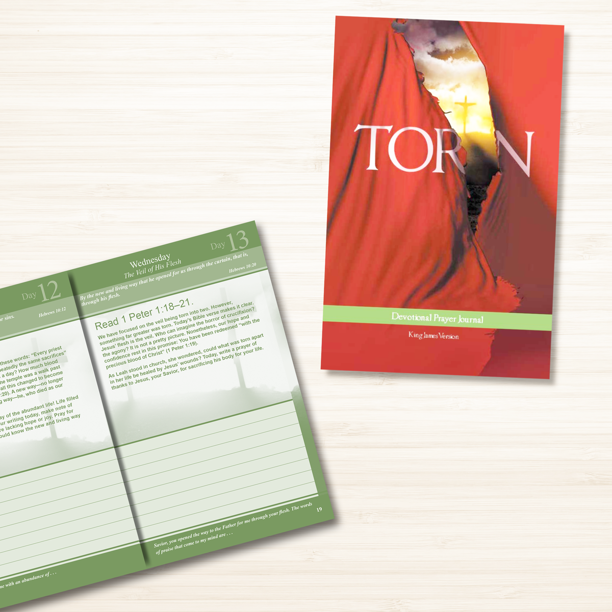 A two-piece Protestant devotional prayer journal set displayed on a light wood background, featuring a red cover with a draped figure and a green interior page layout by CTA Christ to All & CTA Publishing.