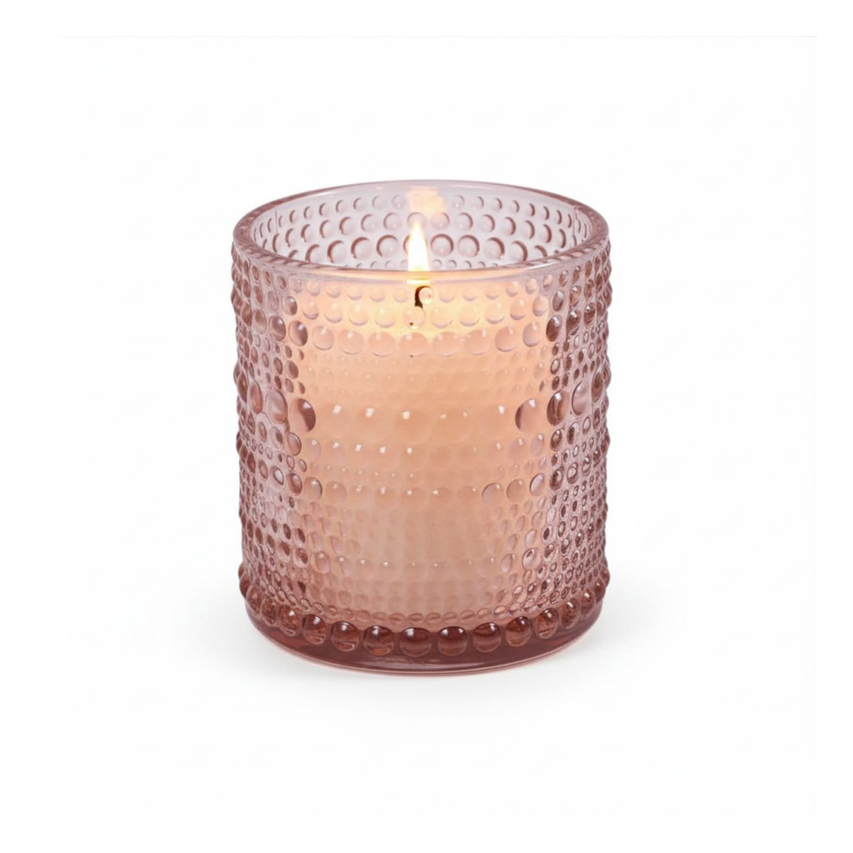 Pink textured glass candle holder with a lit candle on a white background by CTA Christ to All & CTA Gifts.