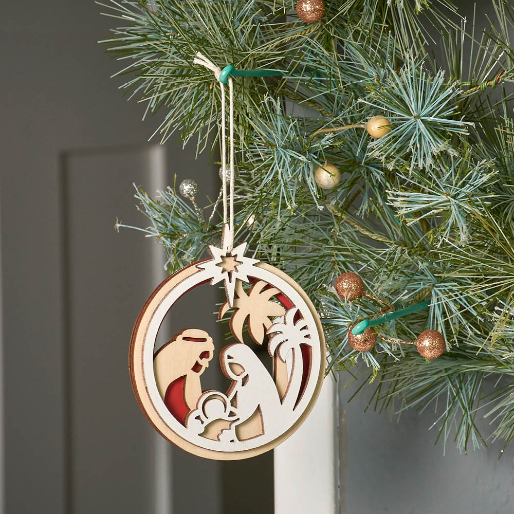 Nativity Laser Cut Wooden Christmas Ornament hanging on a tree