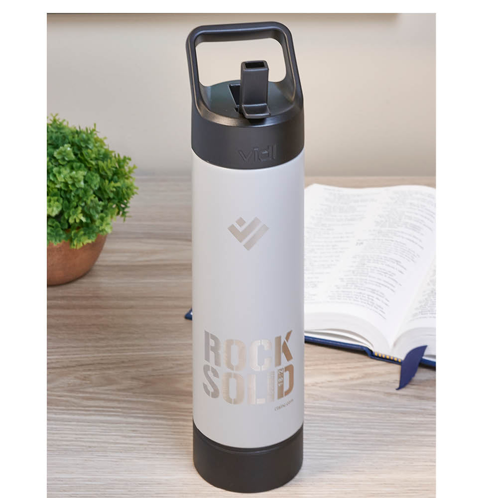 Deluxe Insulated Water Bottle Shown on Table next to Bible